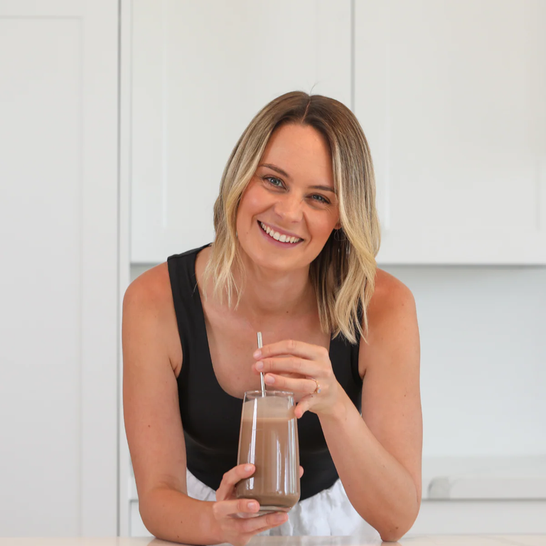 Woman holding CycleBloom product with strawberries